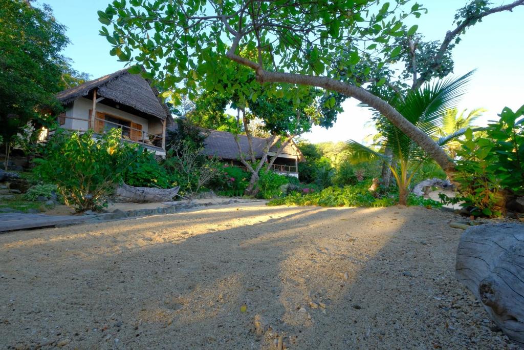 a road in front of a house at Coco Komba Lodge in Nosy Komba