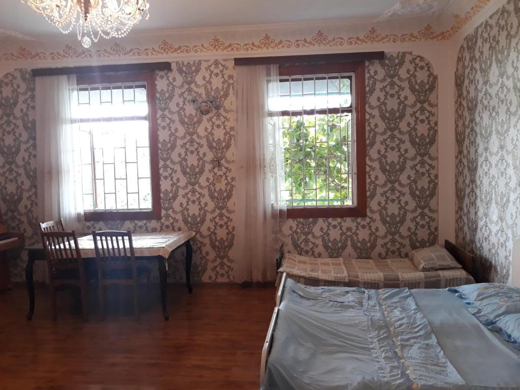 Postel nebo postele na pokoji v ubytování Malkhazi's Guesthouse