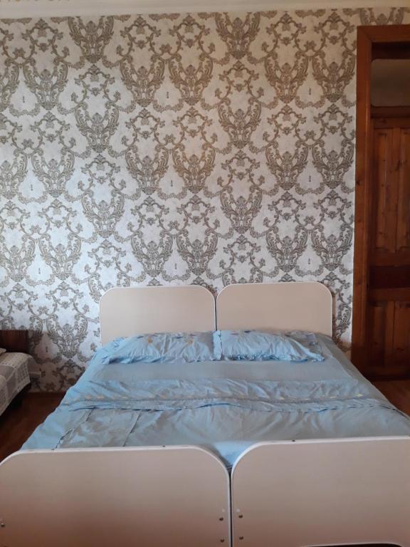 Postel nebo postele na pokoji v ubytování Malkhazi's Guesthouse