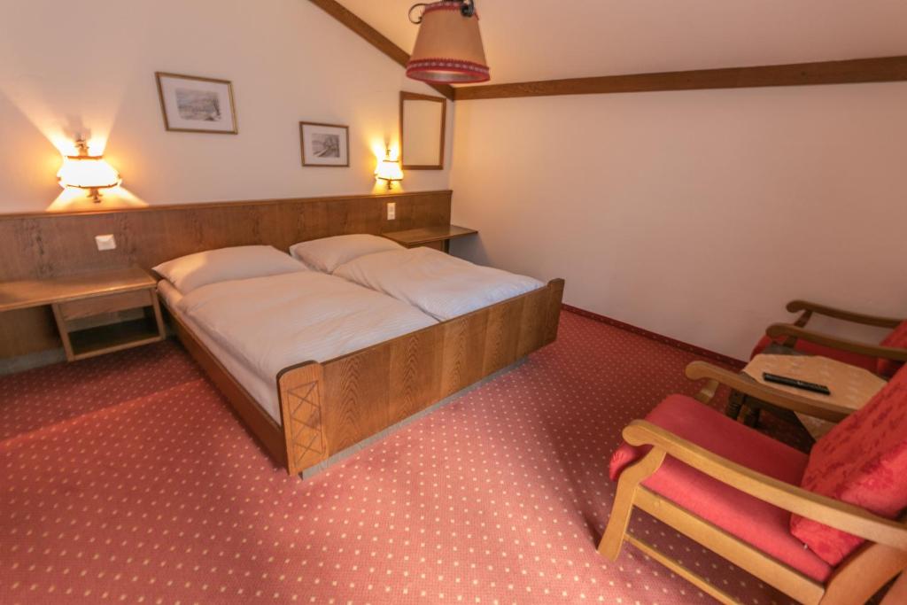 Postel nebo postele na pokoji v ubytování Pension Bergfried