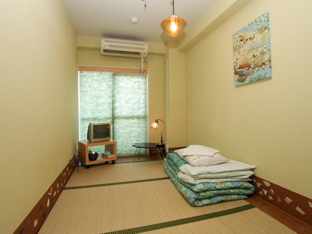 Postel nebo postele na pokoji v ubytování Hostel Zen