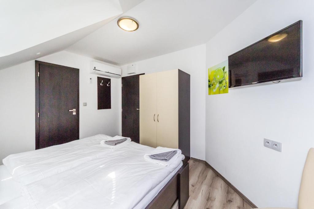 Postel nebo postele na pokoji v ubytování Nová Hospoda - Hotel & Restaurant