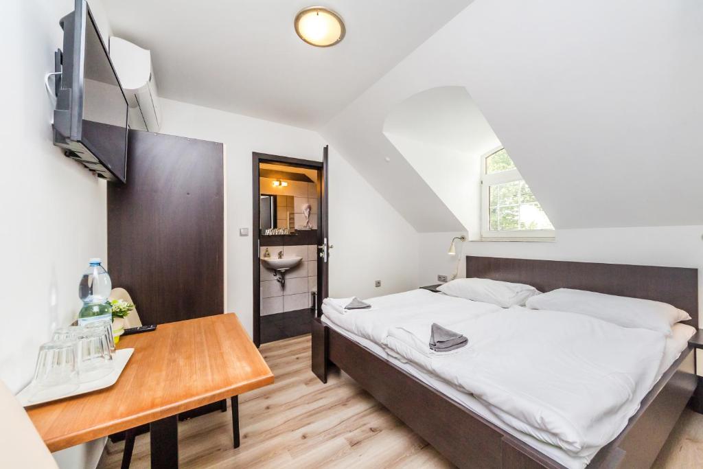Postel nebo postele na pokoji v ubytování Nová Hospoda - Hotel & Restaurant