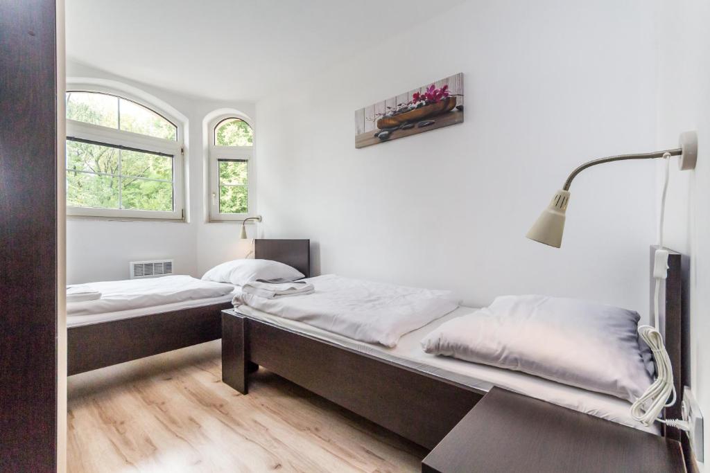 Postel nebo postele na pokoji v ubytování Nová Hospoda - Hotel & Restaurant