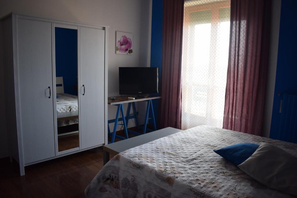Łóżko lub łóżka w pokoju w obiekcie B & B Arco di Sole