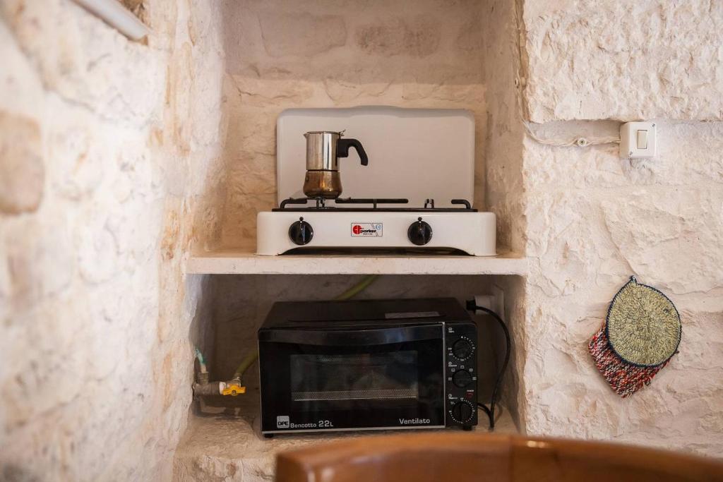 Kuchyň nebo kuchyňský kout v ubytování Trulli e Masseria Ianella
