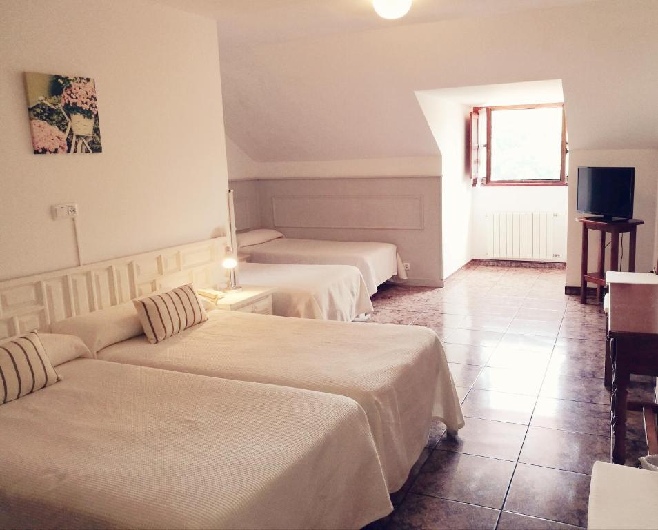 Cama o camas de una habitación en Hotel Solatorre