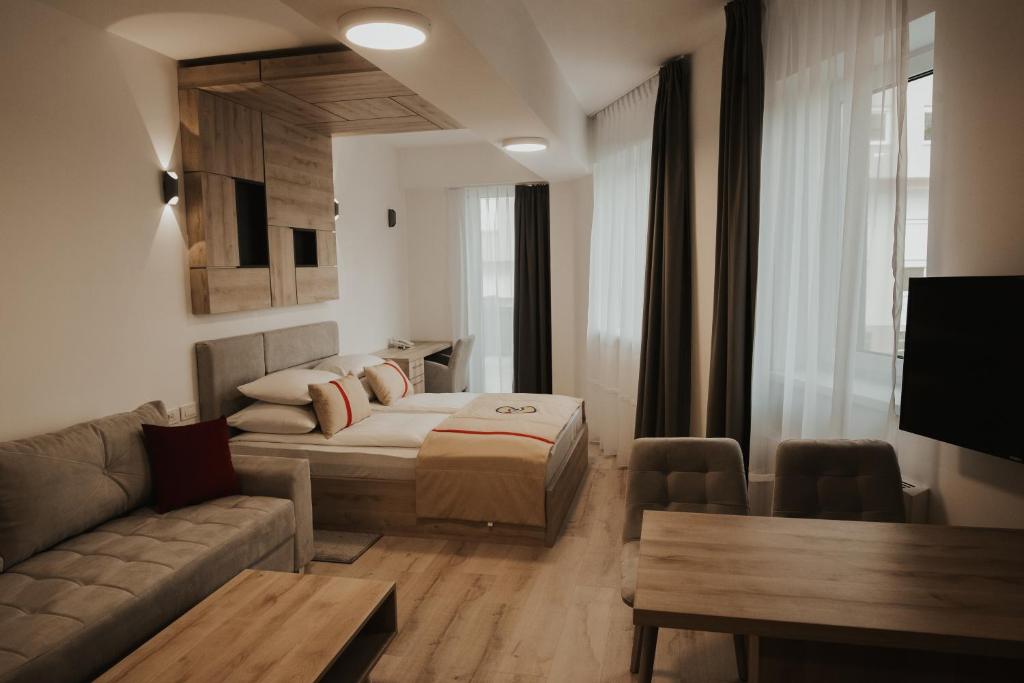 Postel nebo postele na pokoji v ubytování Aparthotel Centar Sarajevo