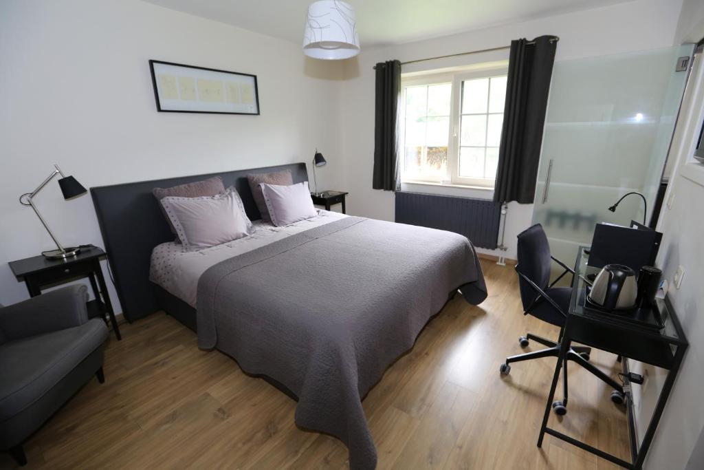 Postel nebo postele na pokoji v ubytování B&B Le Bois de Champia