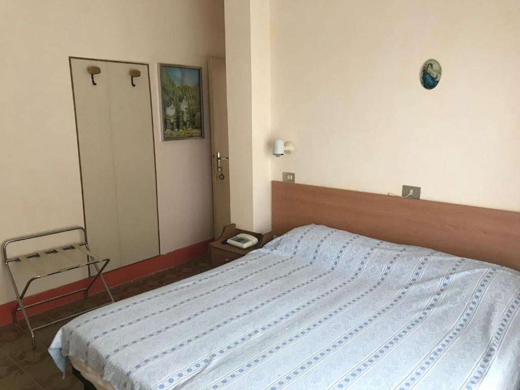 Postel nebo postele na pokoji v ubytování Albergo Villa Dionori