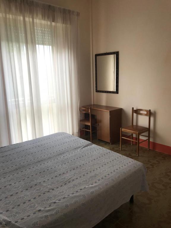 Postel nebo postele na pokoji v ubytování Albergo Villa Dionori