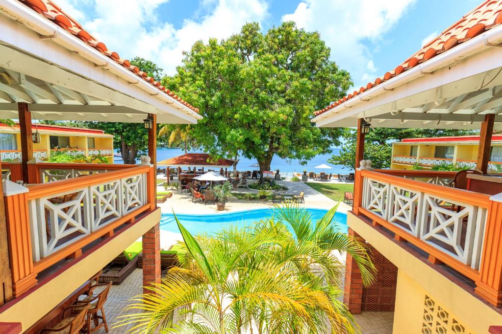 a view of the pool from the balcony of a resort at Sunset Shores Beach Hotel in Kingstown