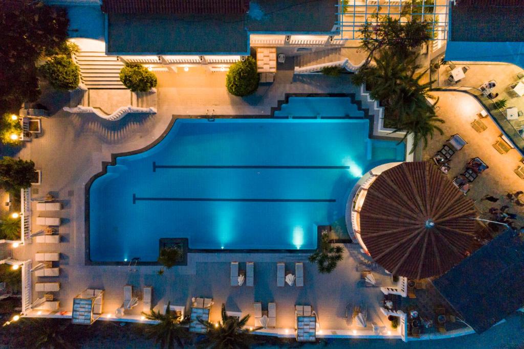 an overhead view of a swimming pool at night at Samos Sun in Pythagoreio