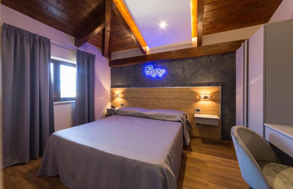 Llit o llits en una habitació de Hotel Vogue