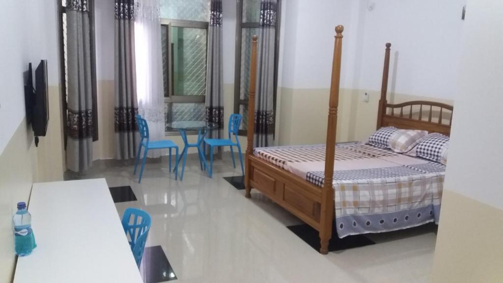 Postel nebo postele na pokoji v ubytování Ayodya Suites Nyali
