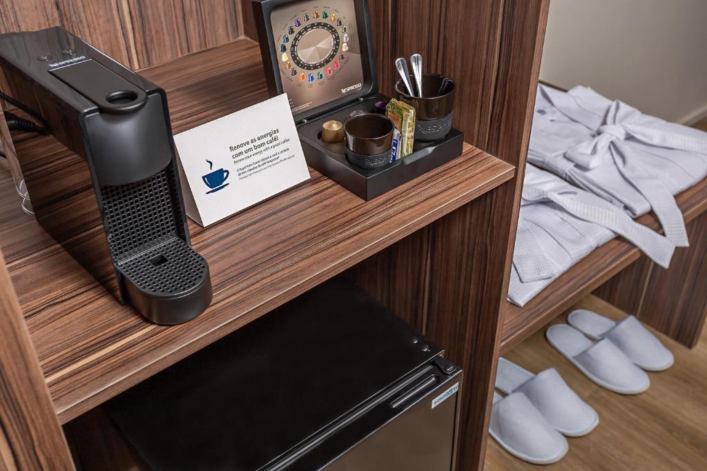 Cama ou camas em um quarto em Royal Palm Tower Anhanguera