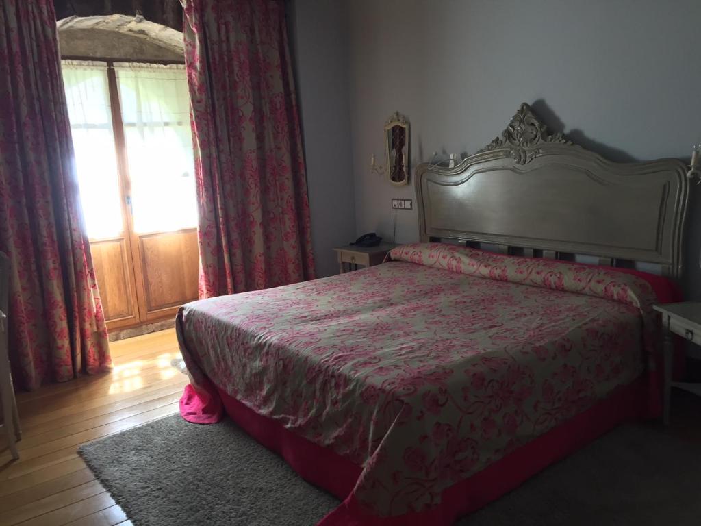 Postel nebo postele na pokoji v ubytování Posada Real Torre Berrueza