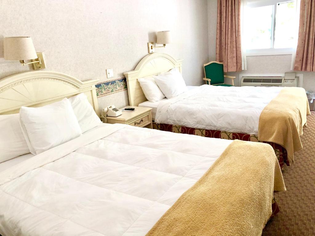 Postel nebo postele na pokoji v ubytování Lyn Aire Motel - Lake George