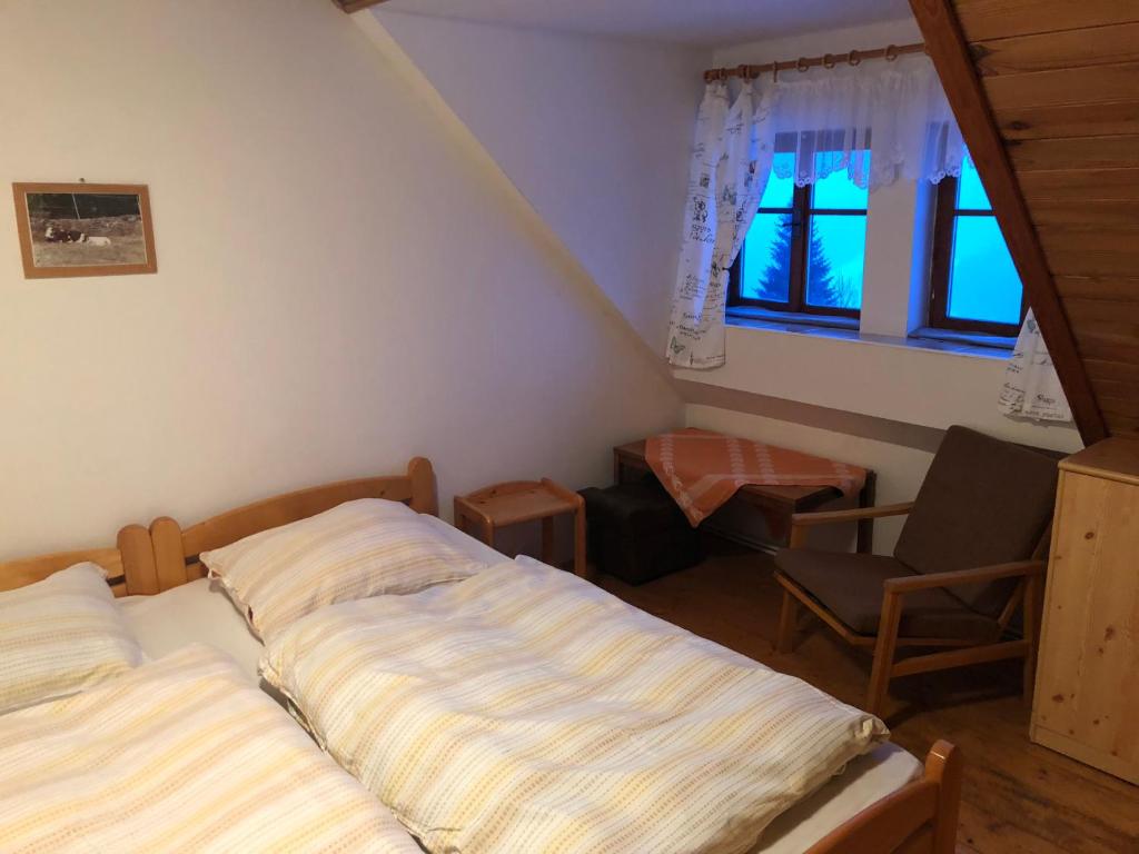 Postel nebo postele na pokoji v ubytování Horský Ranč