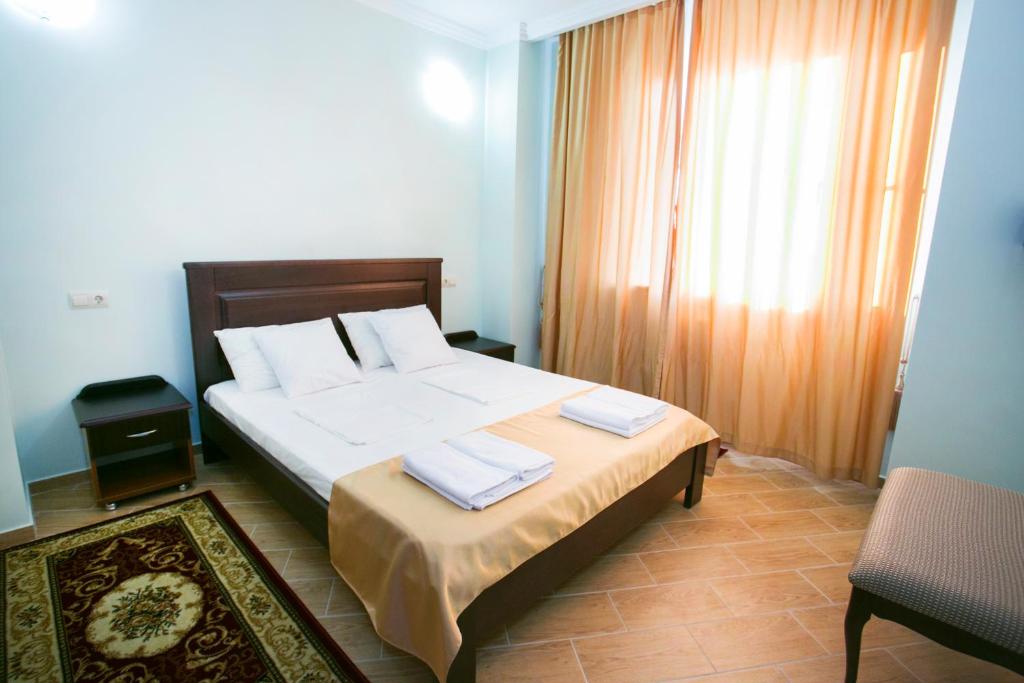 Postel nebo postele na pokoji v ubytování Hotel ACRA