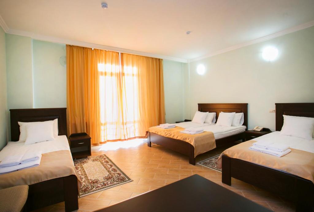 Postel nebo postele na pokoji v ubytování Hotel ACRA