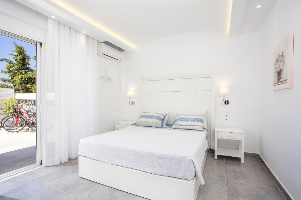 Postel nebo postele na pokoji v ubytování White Passion