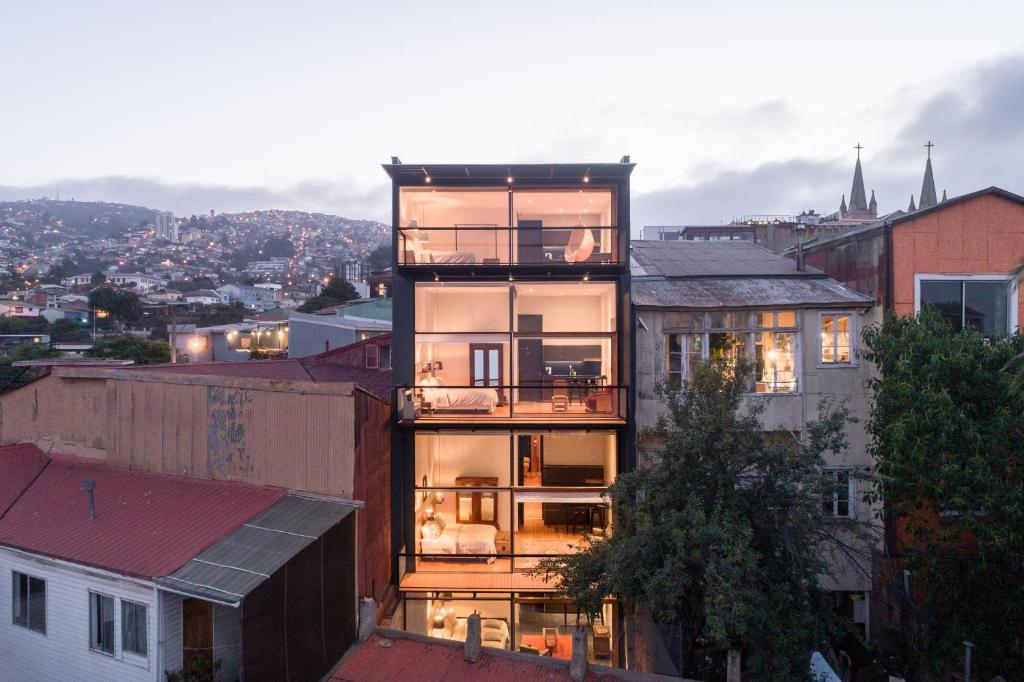 an apartment building with a view of a city at Augusta Hotel in Valparaíso