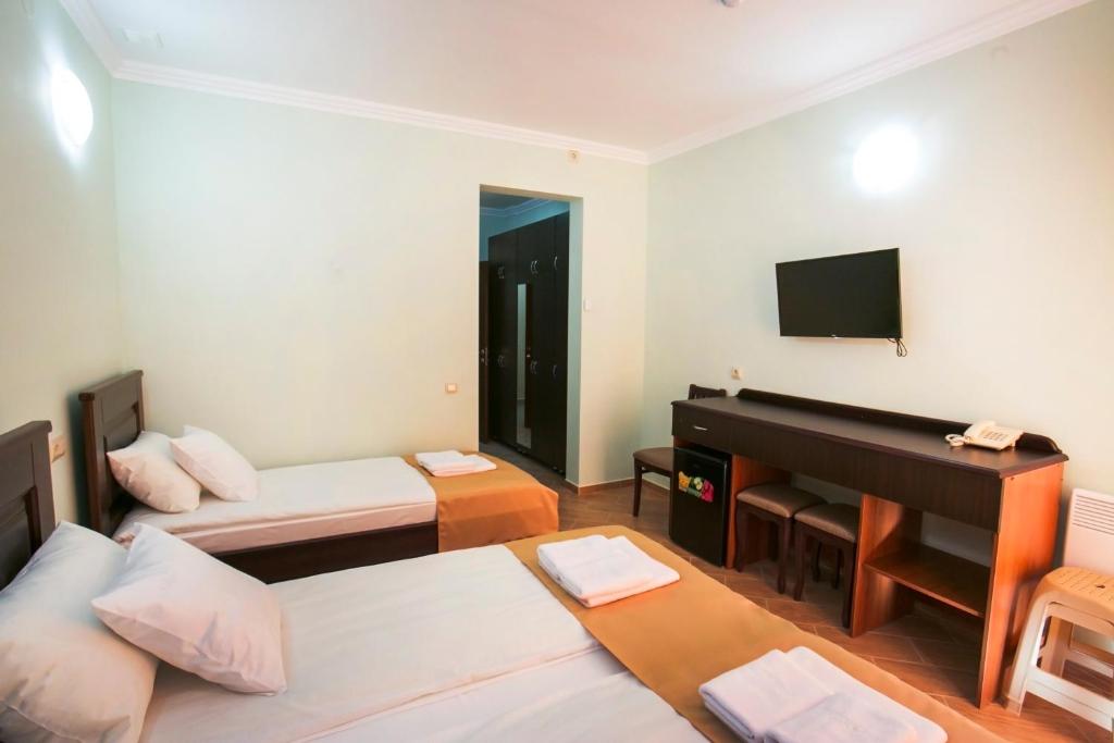 Postel nebo postele na pokoji v ubytování Hotel ACRA