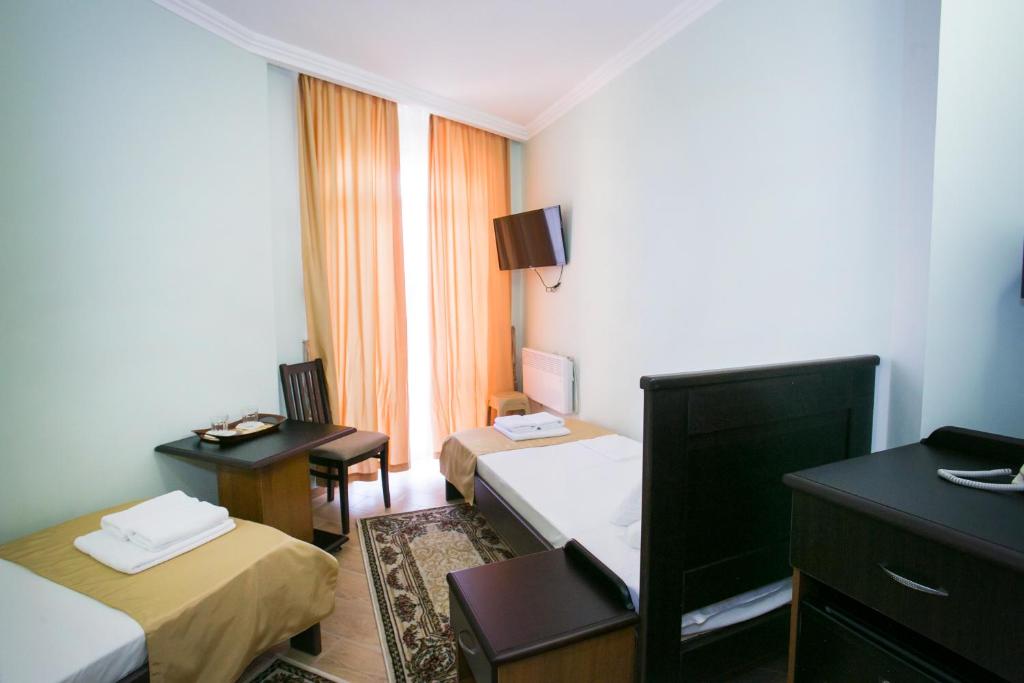 TV a/nebo společenská místnost v ubytování Hotel ACRA