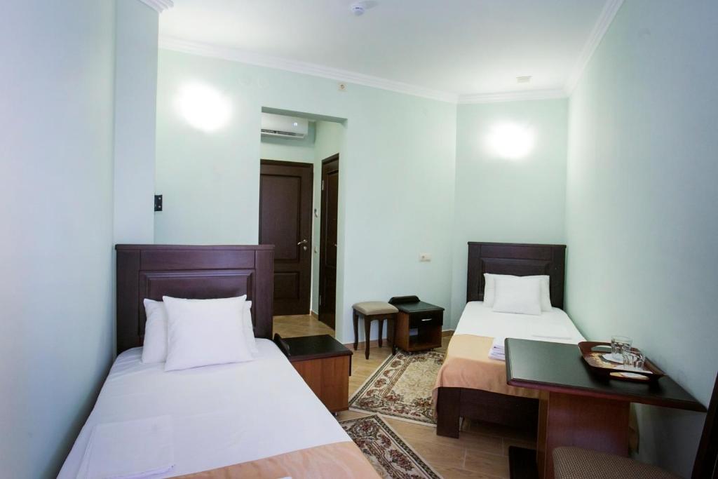 Postel nebo postele na pokoji v ubytování Hotel ACRA