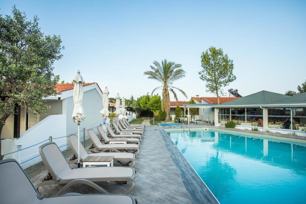 The swimming pool at or close to Coral Blue Beach Hotel Gerakini