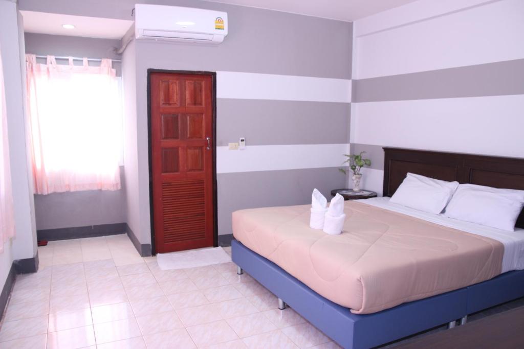 Postel nebo postele na pokoji v ubytování Pimann Place Hotel