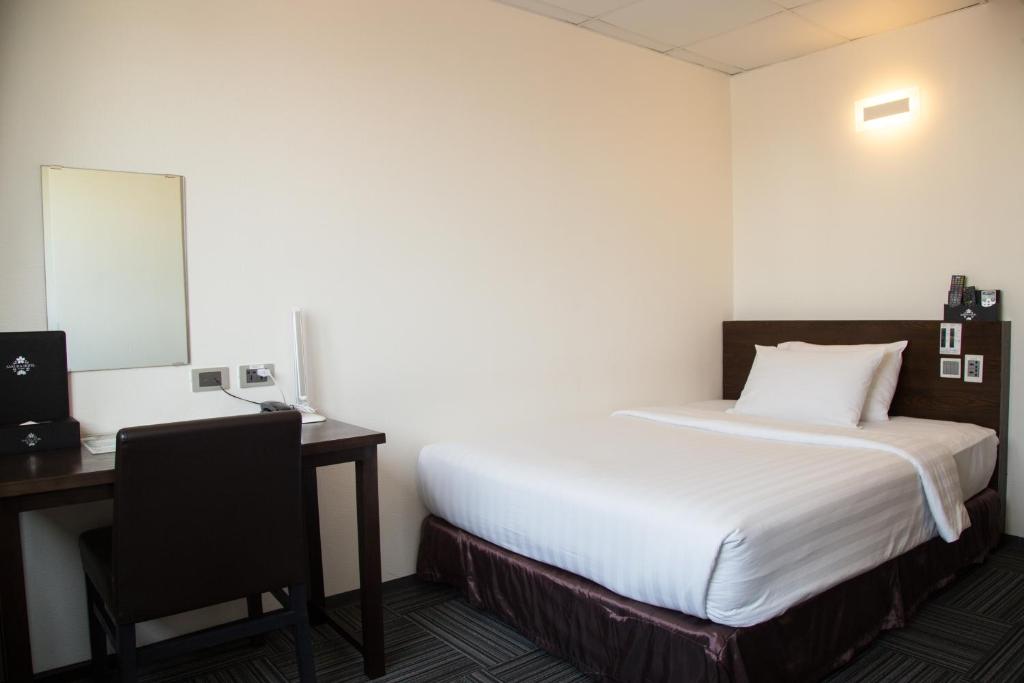 Postel nebo postele na pokoji v ubytování Sakura Hotel 3
