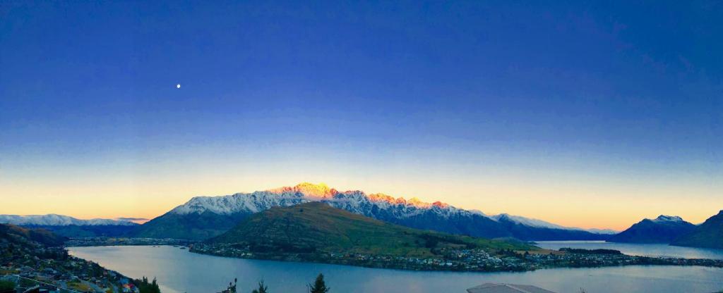 a view of a mountain with a body of water at Amazing April May deal in Queenstown