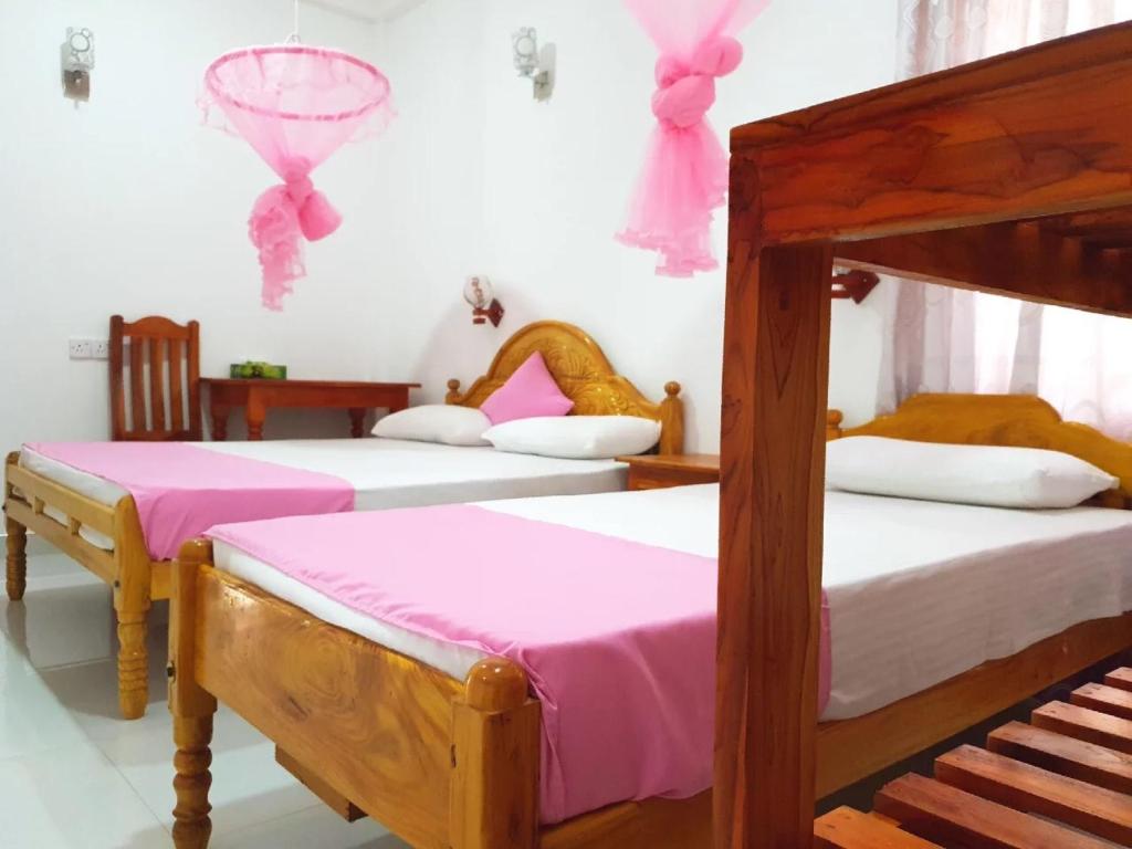 Postel nebo postele na pokoji v ubytování SNP Star Guest House
