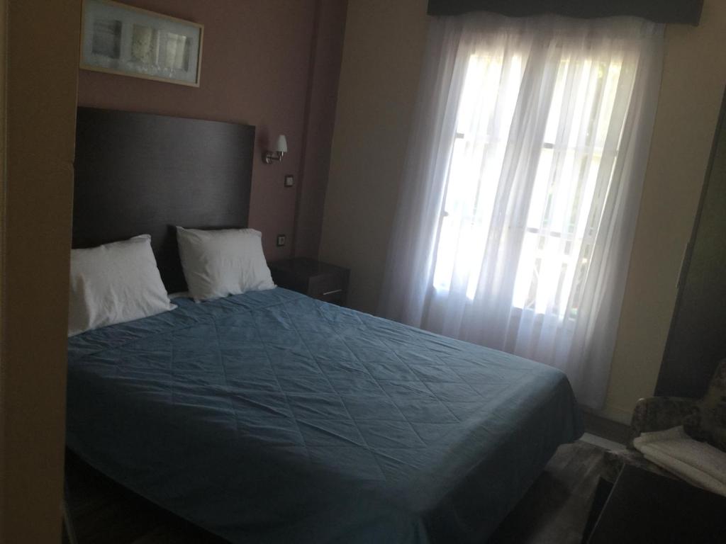 A bed or beds in a room at Villa Vasso
