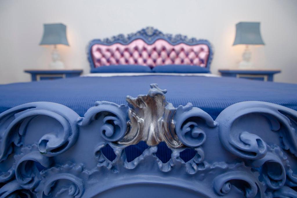 A bed or beds in a room at à Marchisa -Noto-