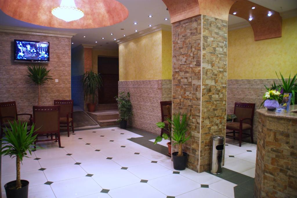 TV a/nebo společenská místnost v ubytování Al Qidra Hotel & Suites Aqaba