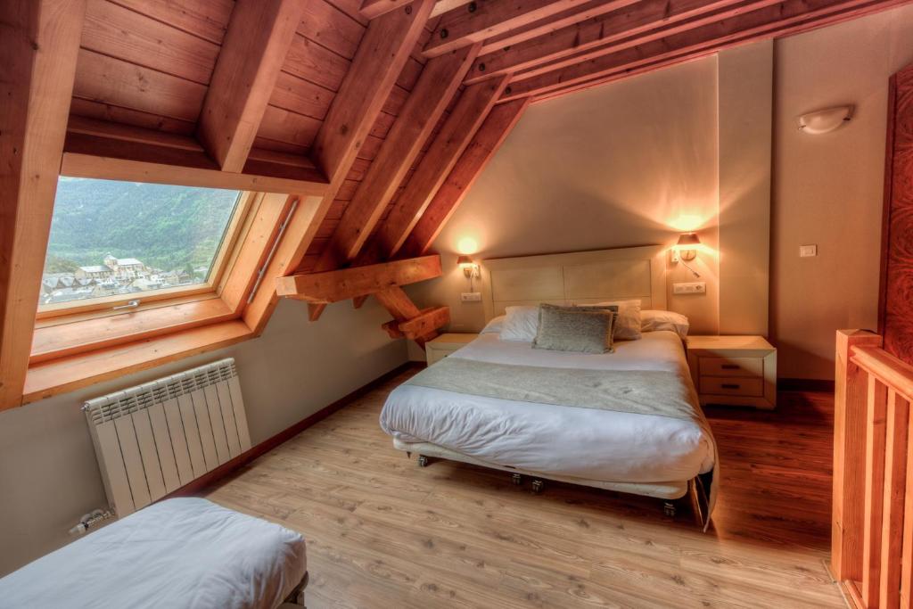 Postel nebo postele na pokoji v ubytování Apartahotel Tres Quiñones