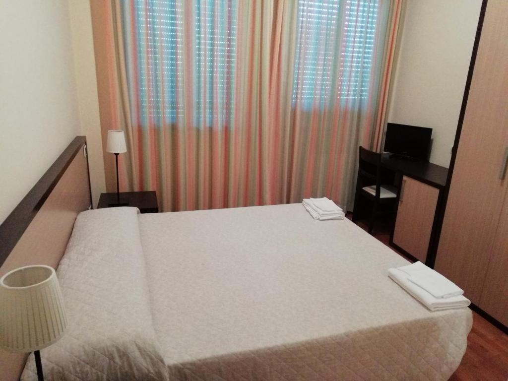 Postel nebo postele na pokoji v ubytování Hotel La Fonte