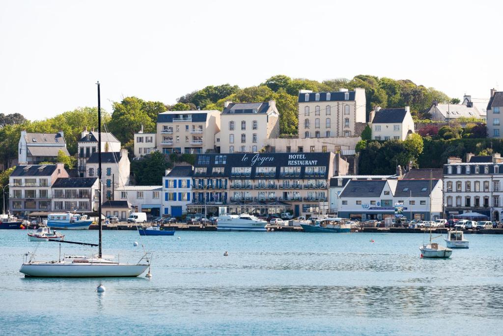 a group of boats on the water in a harbor at Logis hôtel restaurant Le Goyen in Audierne