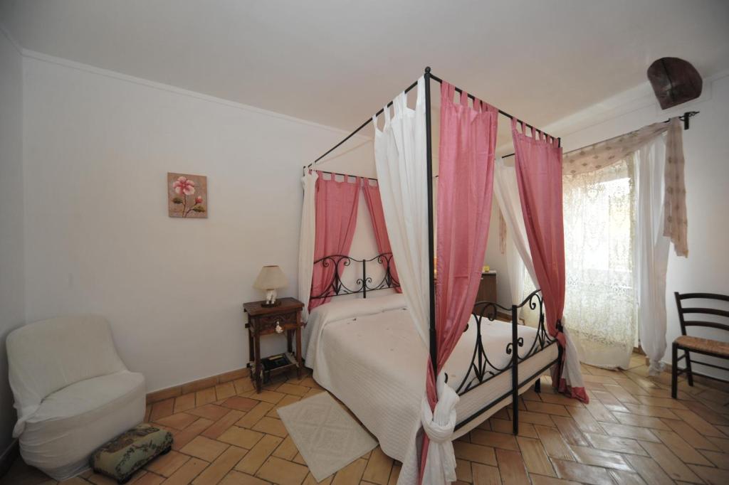 Łóżko lub łóżka w pokoju w obiekcie Romantica Pucci