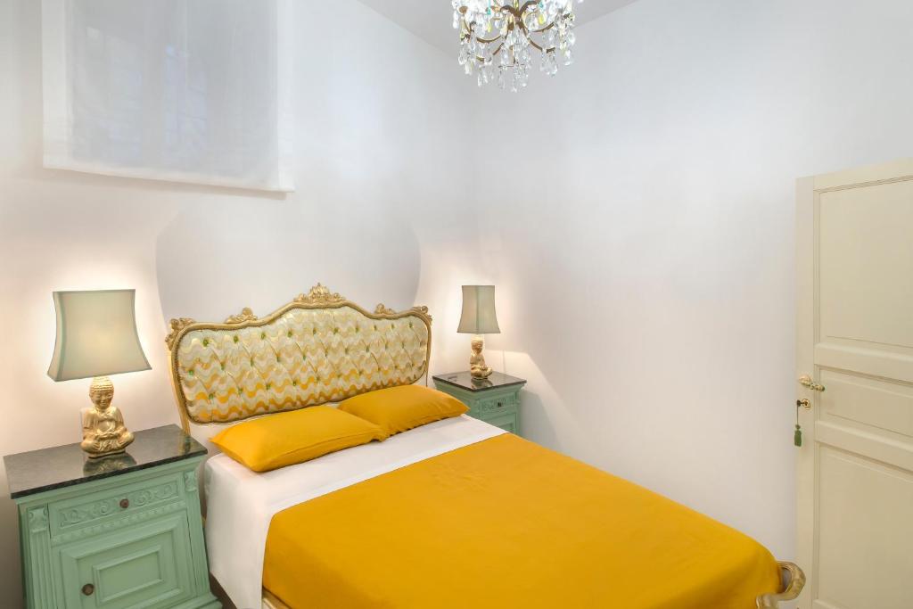 A bed or beds in a room at à Marchisa -Noto-