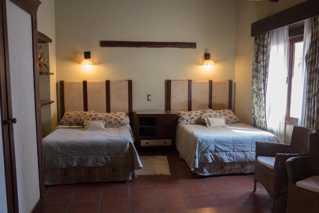 La Casa De La Bodega - Wine Boutique Hotel tesisinde bir odada yatak veya yataklar