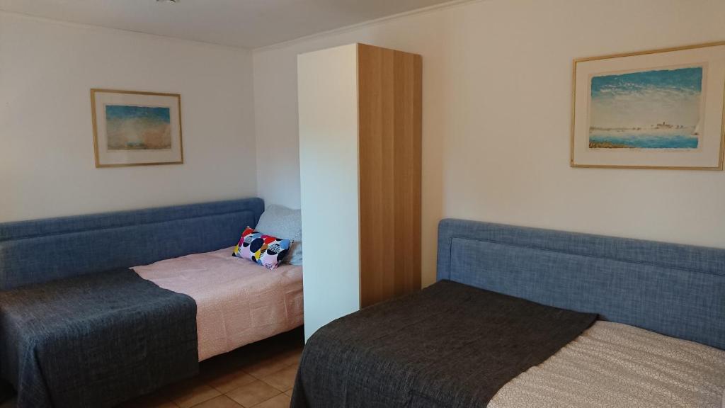 Postel nebo postele na pokoji v ubytování IGMA Lodge