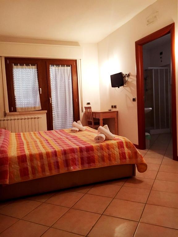 Postel nebo postele na pokoji v ubytování Camere Rufino A POCHI CHILOMETRI DAL CENTRO DI PERUGIA E DA ASSISI