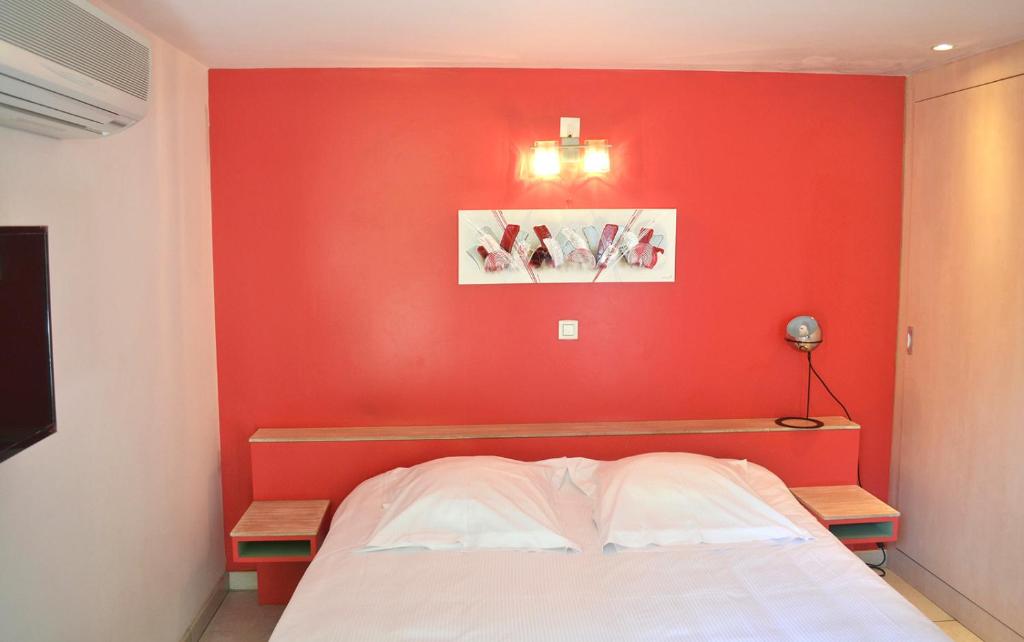 Postel nebo postele na pokoji v ubytování Hôtel la Scala
