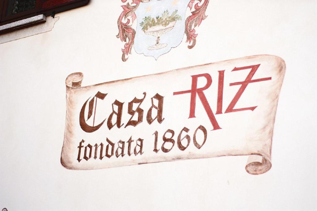 Naktsmītnes AGRITURISMO Casa Riz logotips vai norāde
