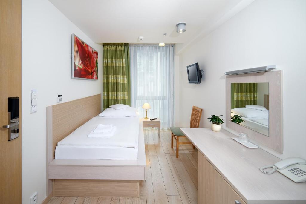 TV a/nebo společenská místnost v ubytování Hotel Ankora