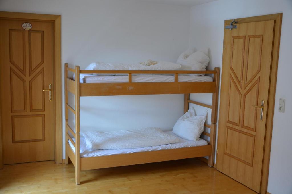 a couple of bunk beds in a room at Ski In / Ski Out - Gästehäuser Saalbach-Hinterglemm in Saalbach-Hinterglemm